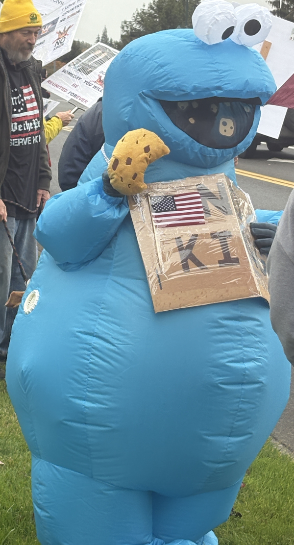Blow up Cookie Monster with No Kings sign